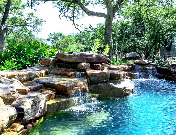 Pool - large rustic custom-shaped natural pool idea with decking